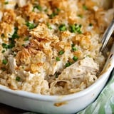 A creamy chicken casserole topped with crunchy golden bread crumbs and garnished with chopped green onions.